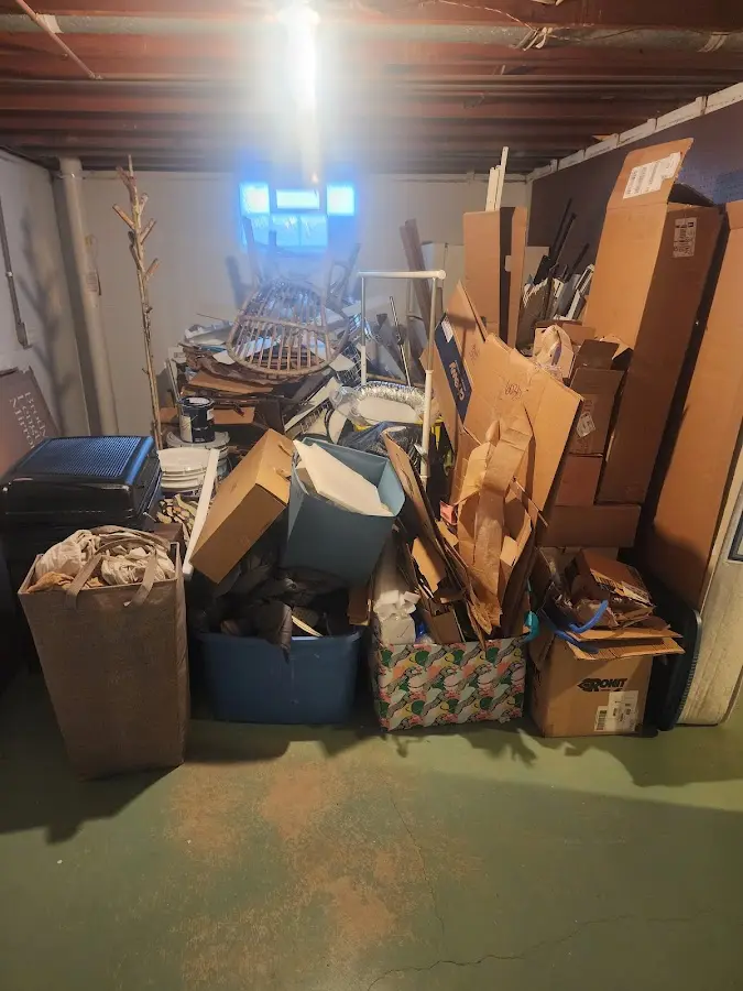 Roll-off dumpster container at job site for 2 Yard Dumpster Rental in Corbin